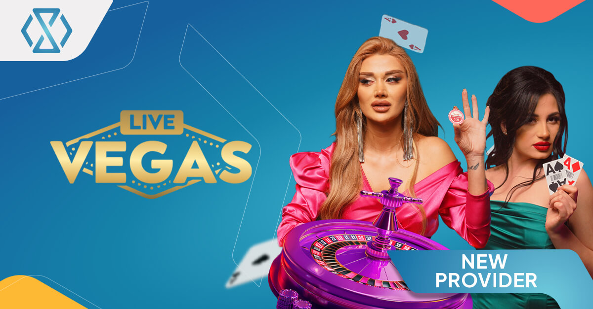Promotional banner for Live Vegas showing two live casino presenters, a roulette wheel, playing cards and casino chips, highlighting the provider’s live roulette focus and its arrival as a new provider in the Timeless Tech Game Aggregator.
